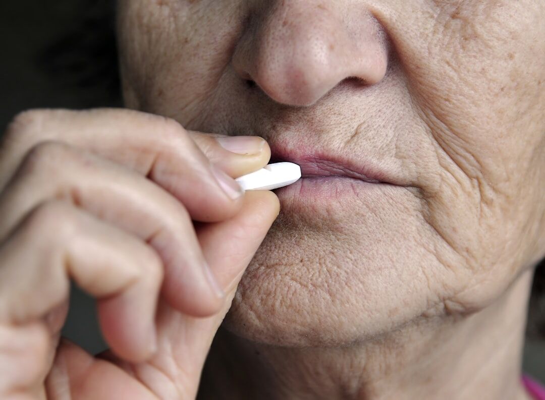 senior reading medication label