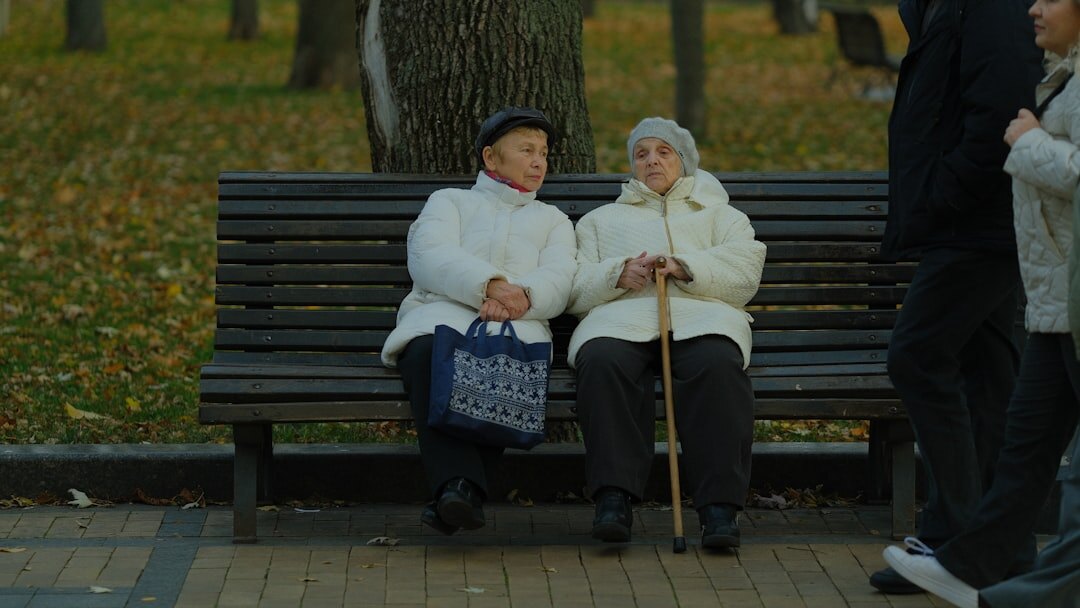 senior couple resting on bench