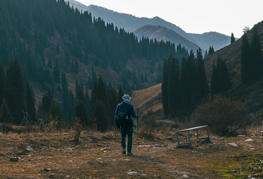 elderly man hiking in mountains