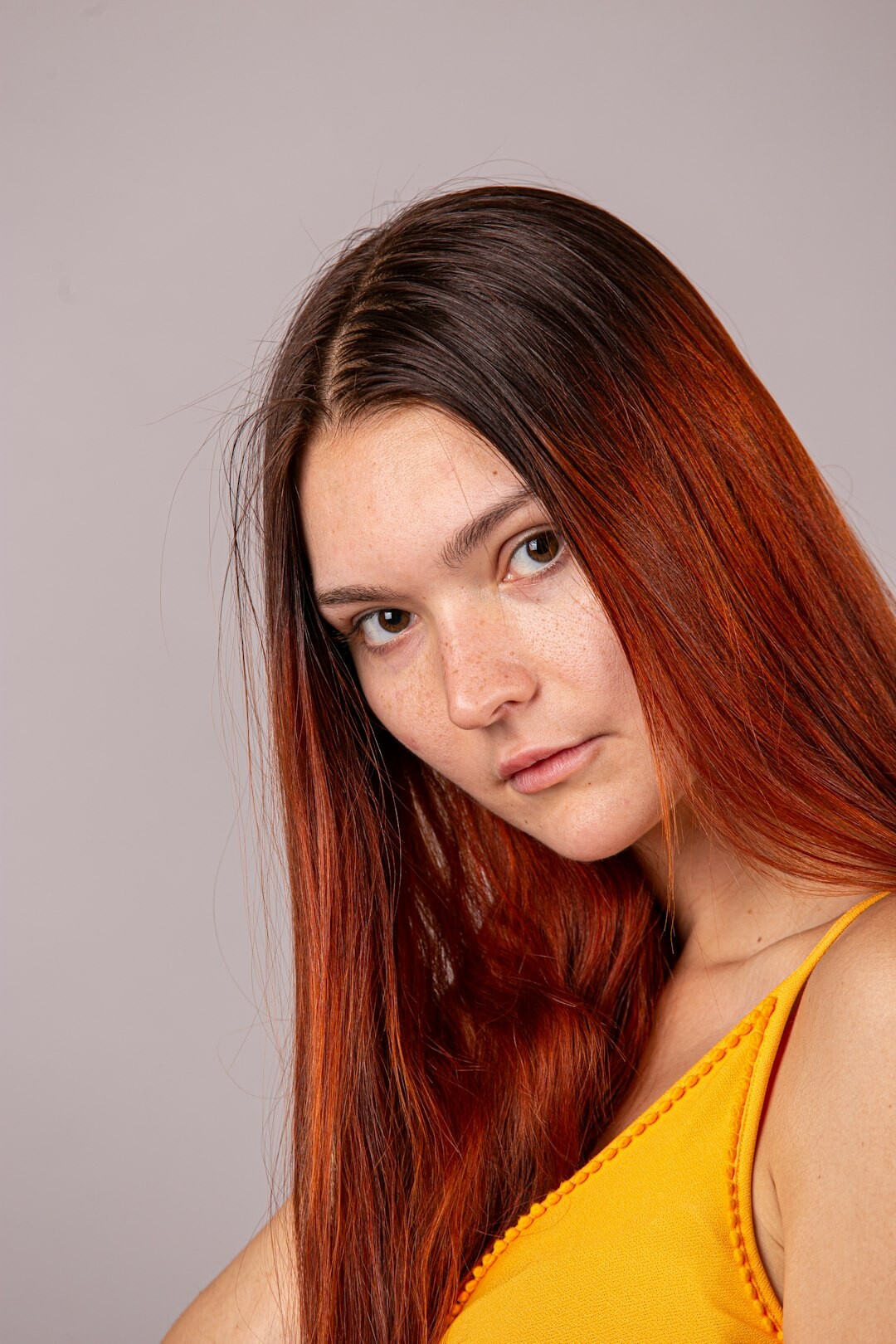 Studio portrait of a younger Slovak woman social worker smiling