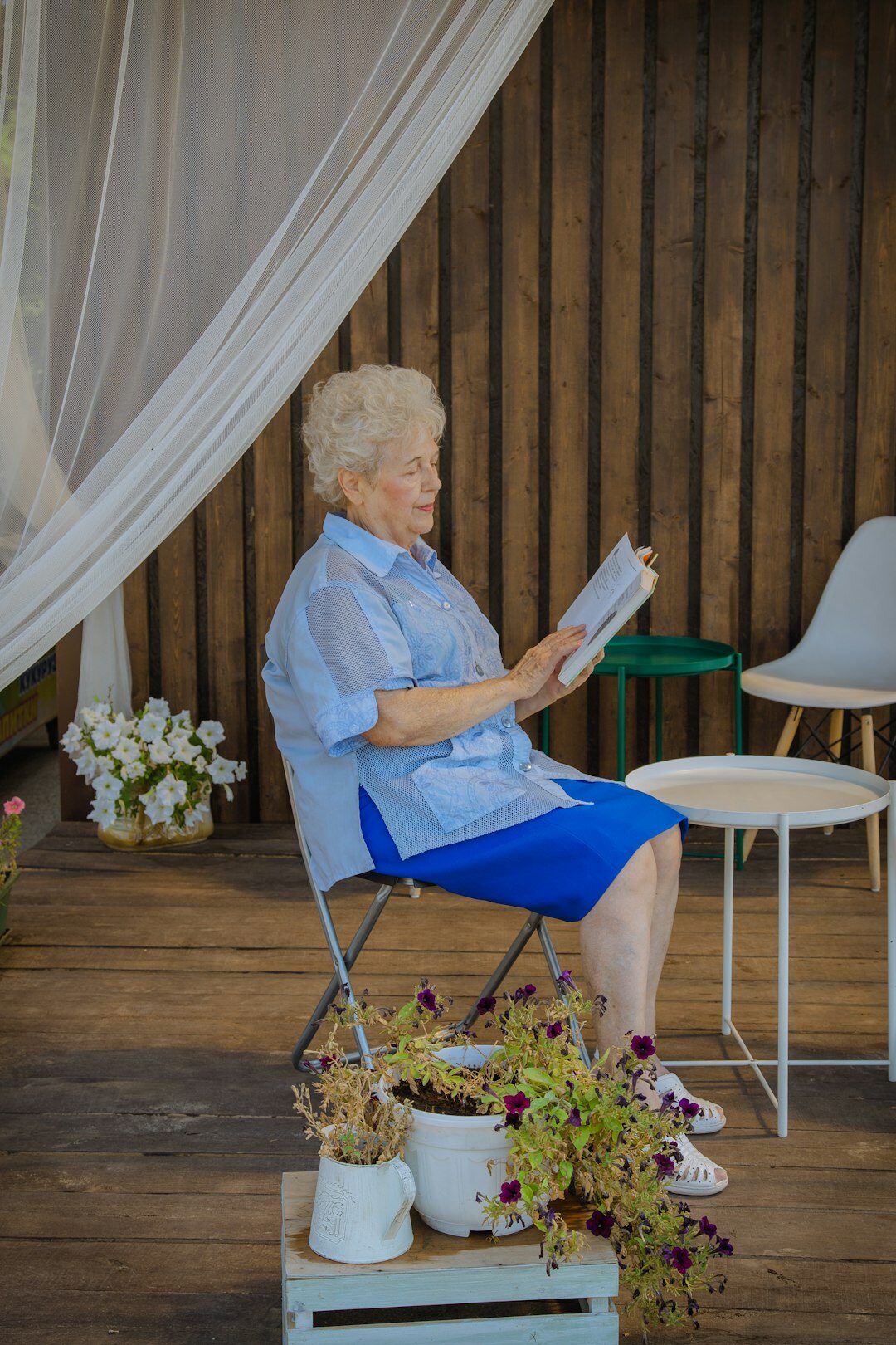 elderly woman reading book