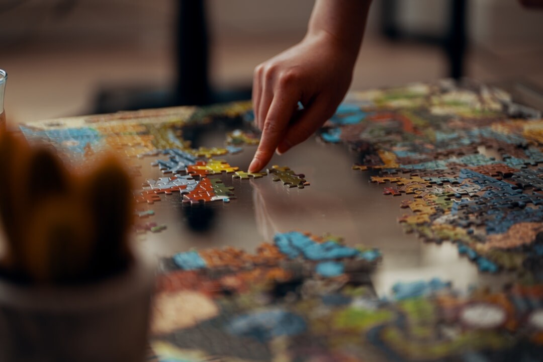 senior solving jigsaw puzzle